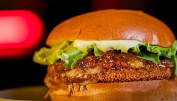 juicy gourmet burger on dark background