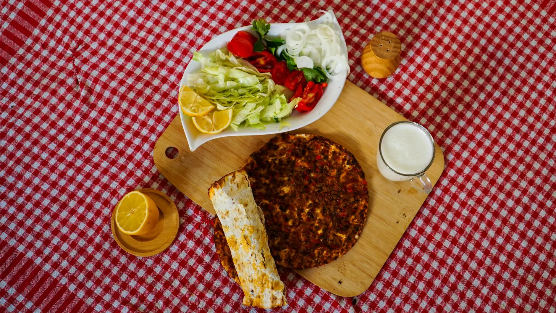 traditional turkish lahmacun meal on checkered tablecloth