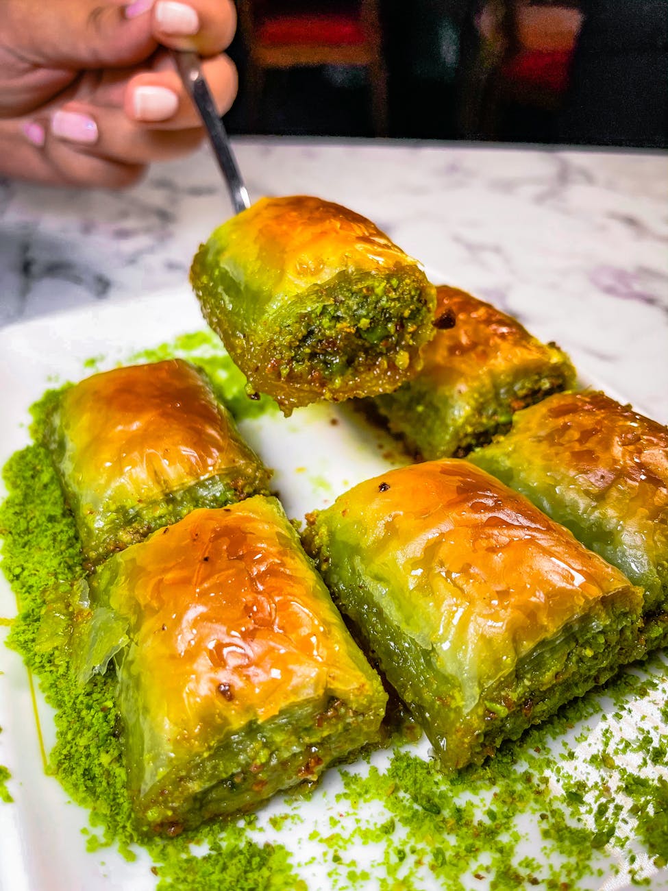 slices of baklava on white ceramic plate