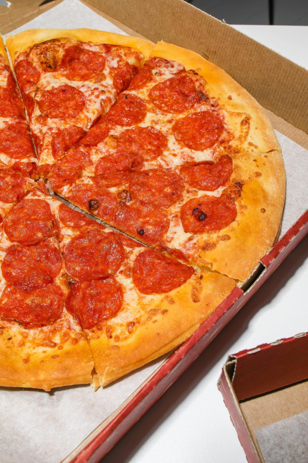 Pepperoni pizza on a box