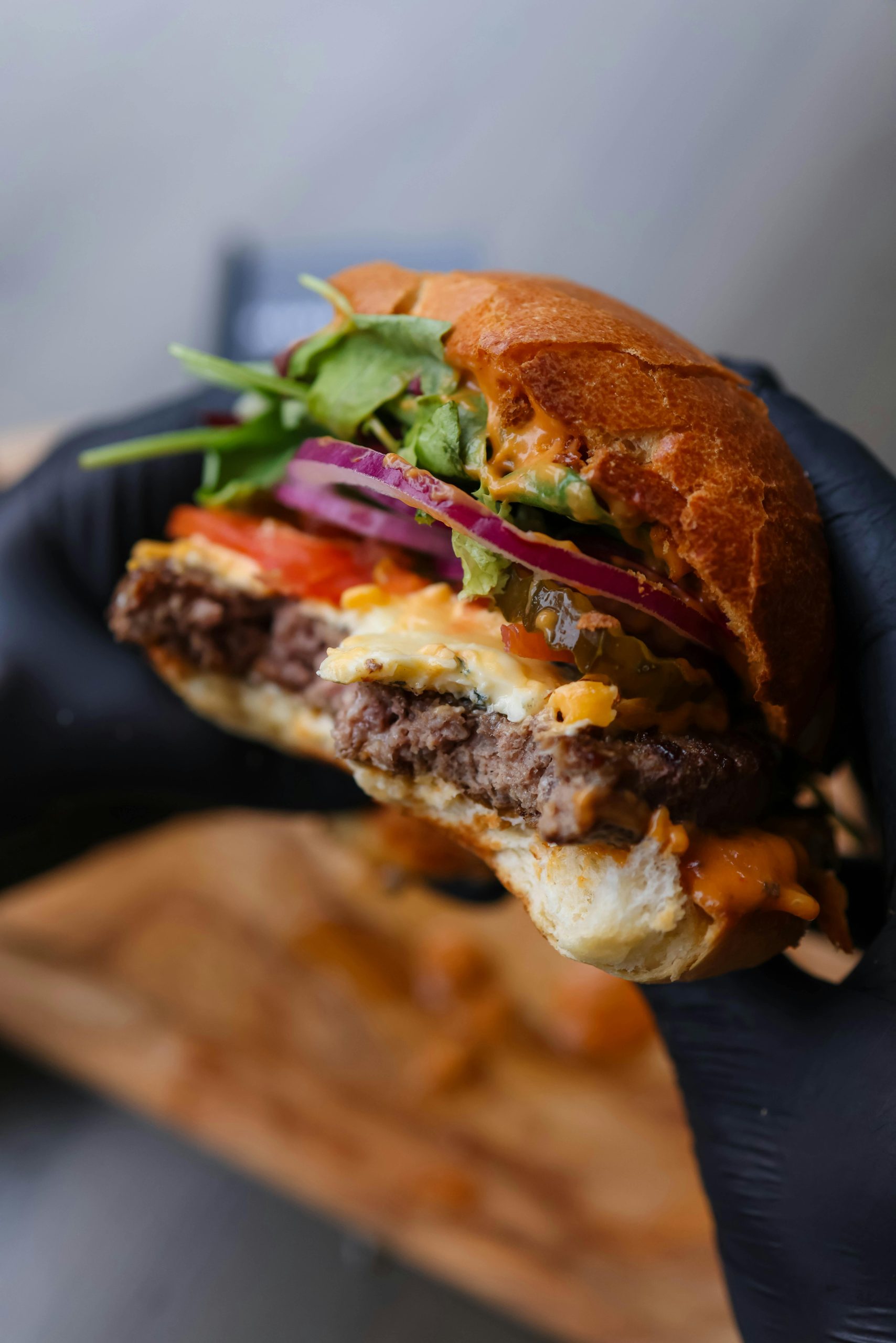 Juicy gourmet cheeseburger with toppings