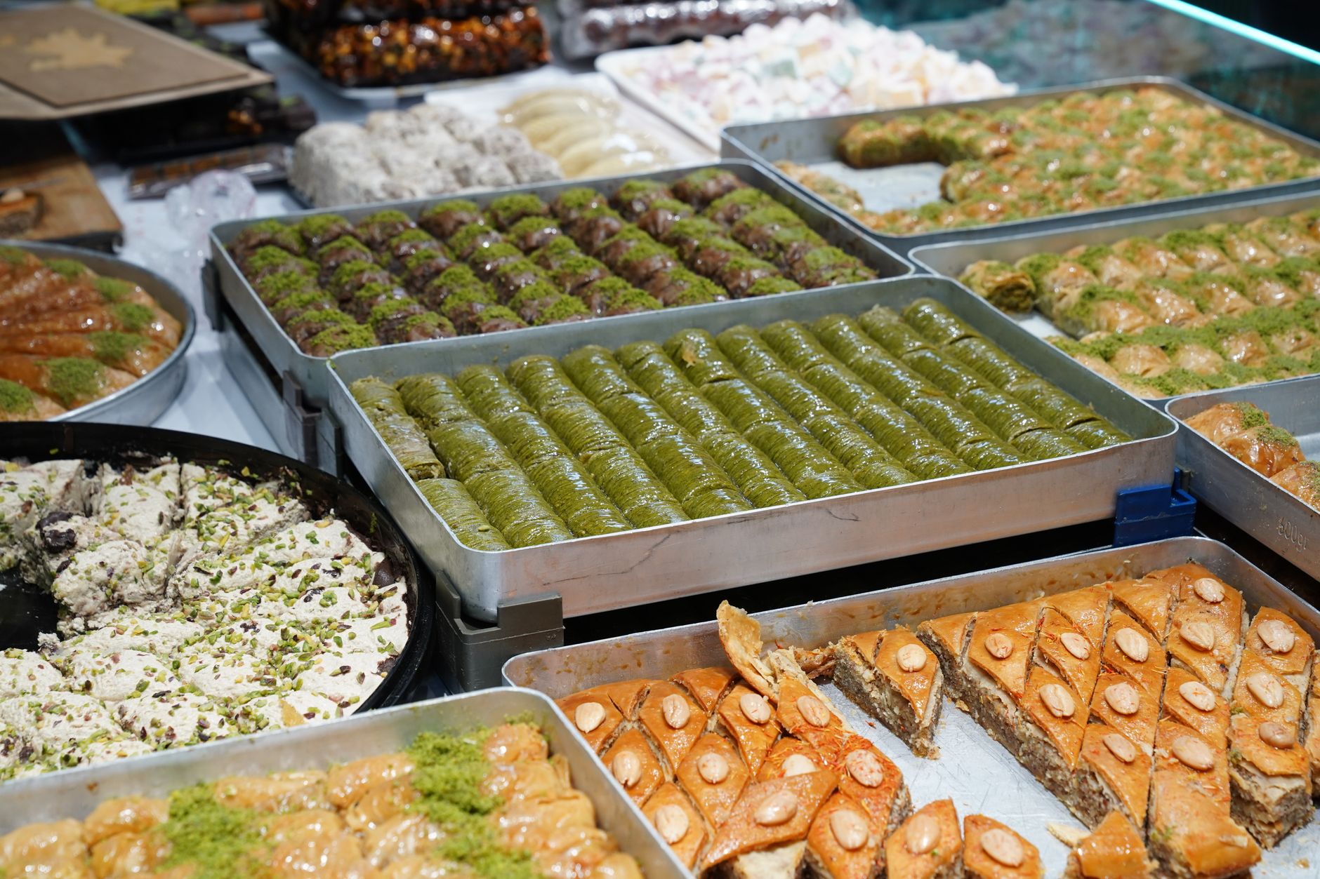 assorted turkish desserts display in bakery
