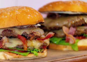 Delicious bacon cheeseburgers with fresh lettuce