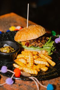 Delicious burger and fries with vibrant decor
