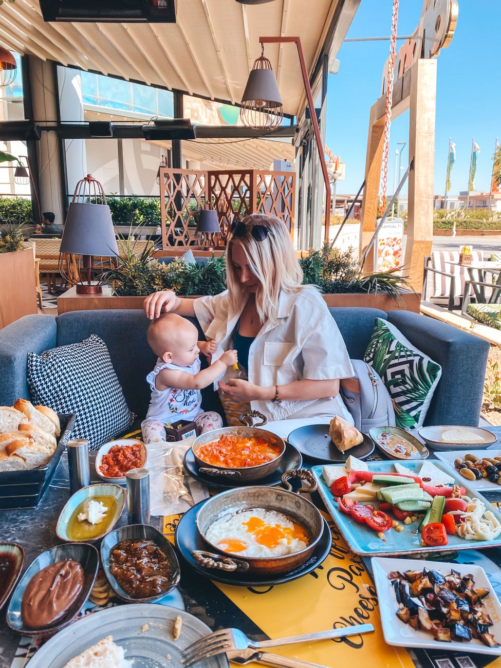 mother and baby dining in outdoor cafe izmir
